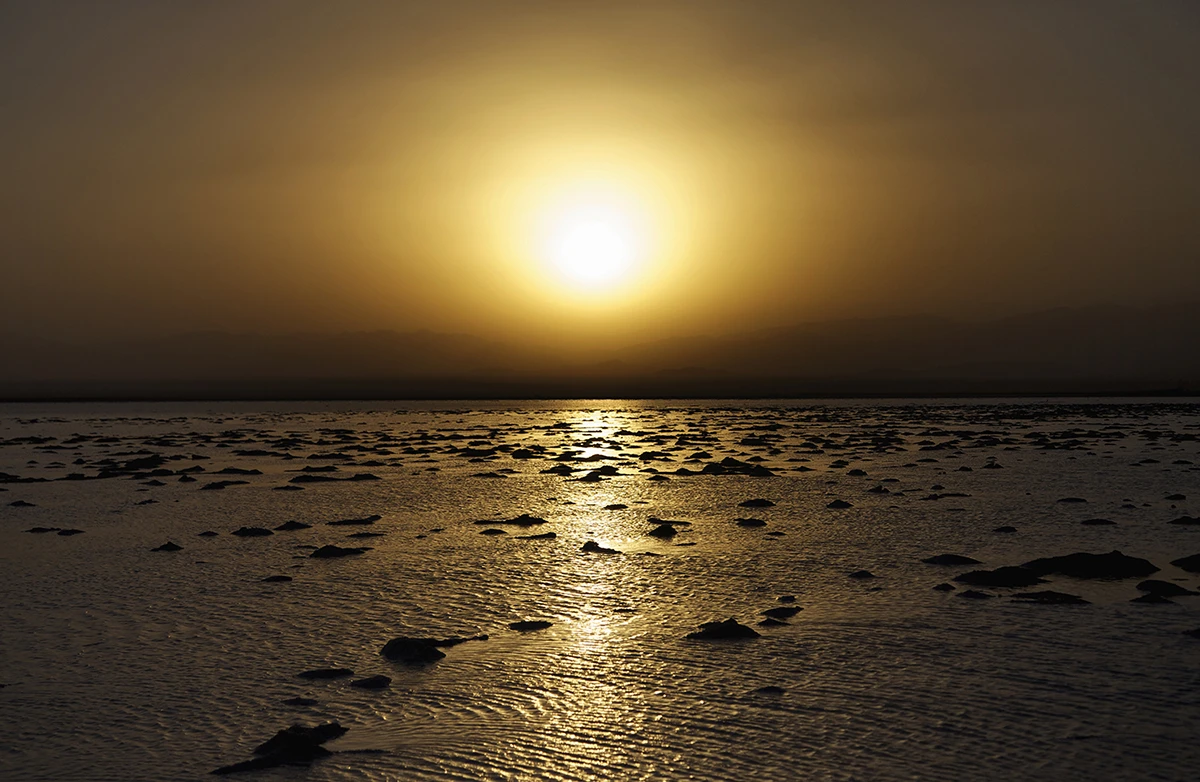 The sun setting on the salt flats in Danakil Depression
