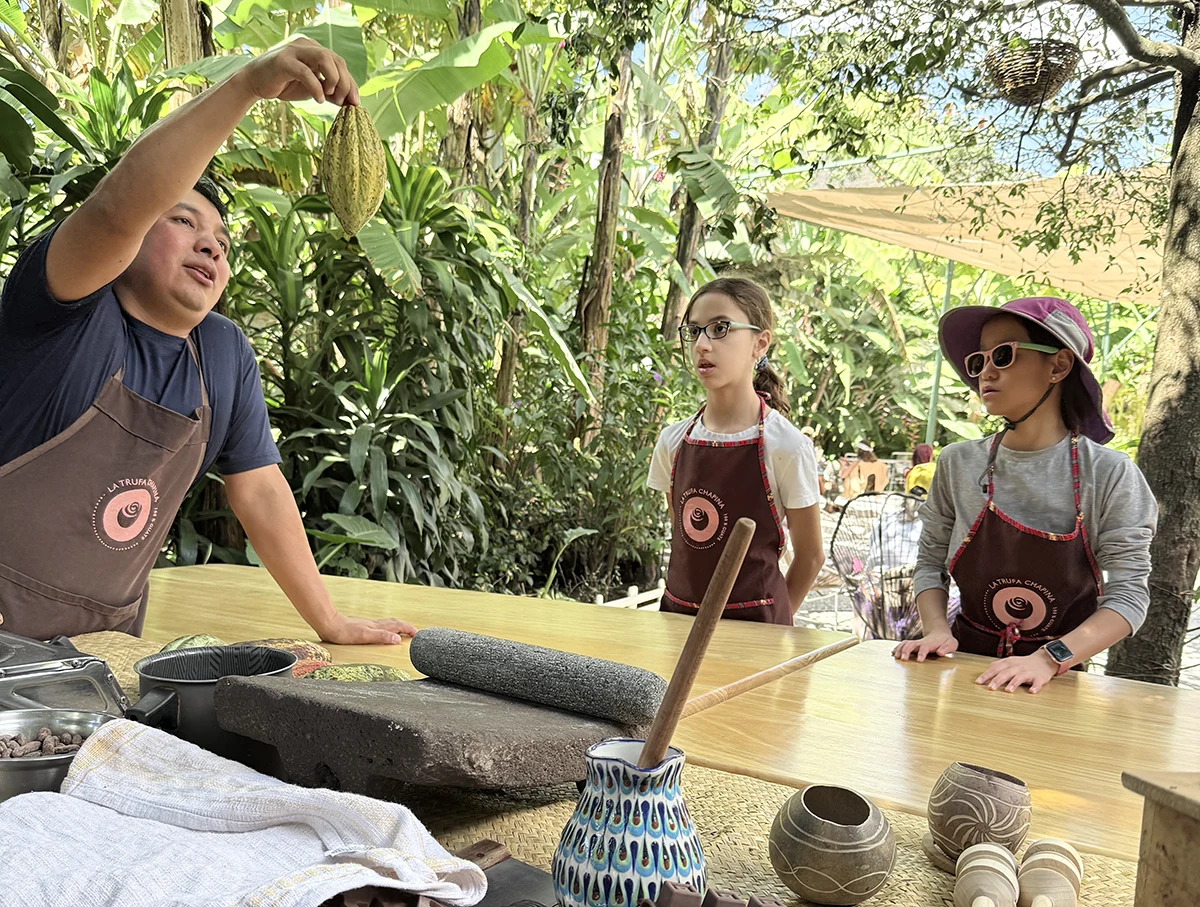 My daughter and a friend's daughter learning about cacao seeds